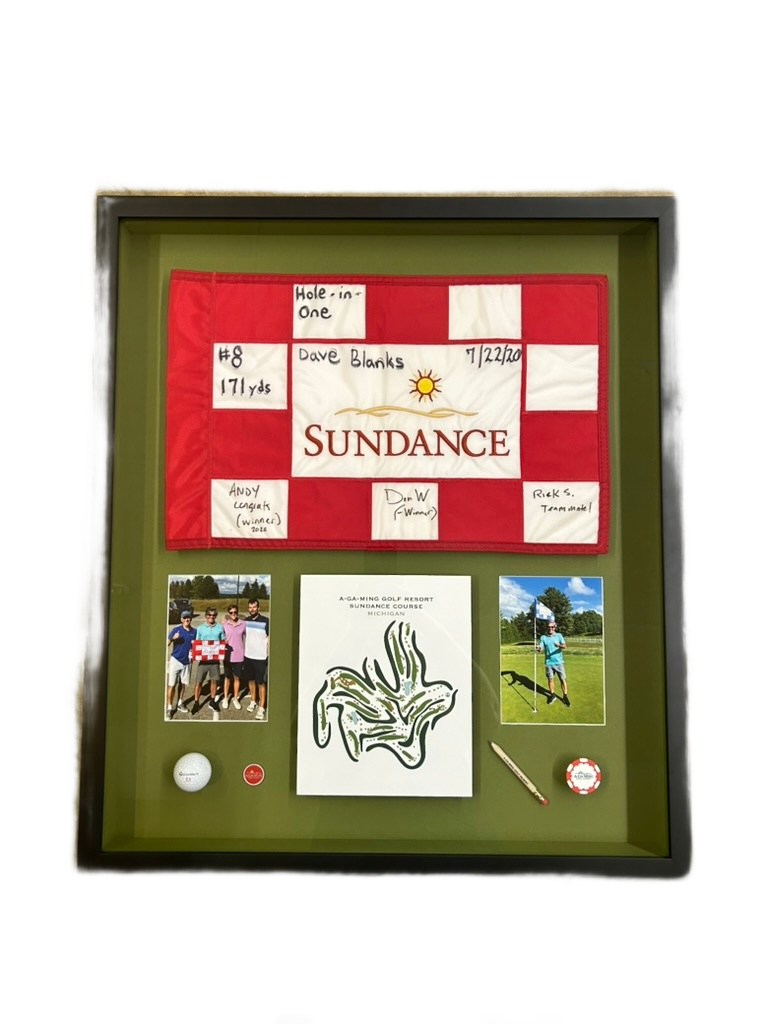Framed sports memorabilia and jersey shadow box