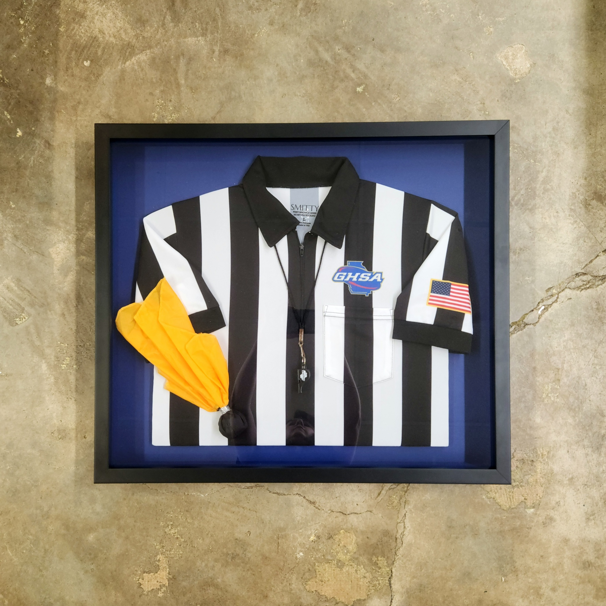 Framed sports memorabilia and jersey shadow box