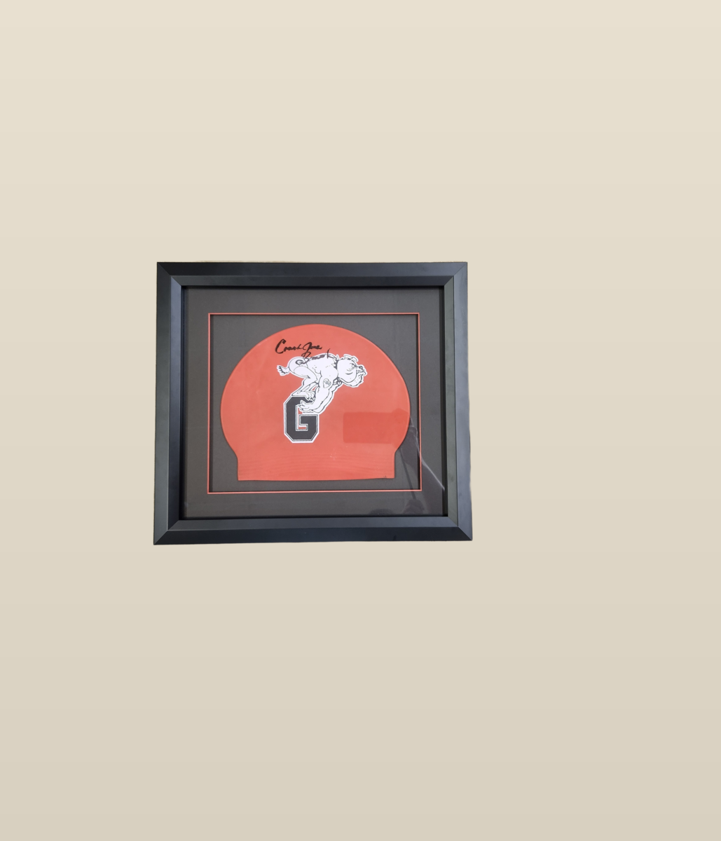 Framed sports memorabilia and jersey shadow box