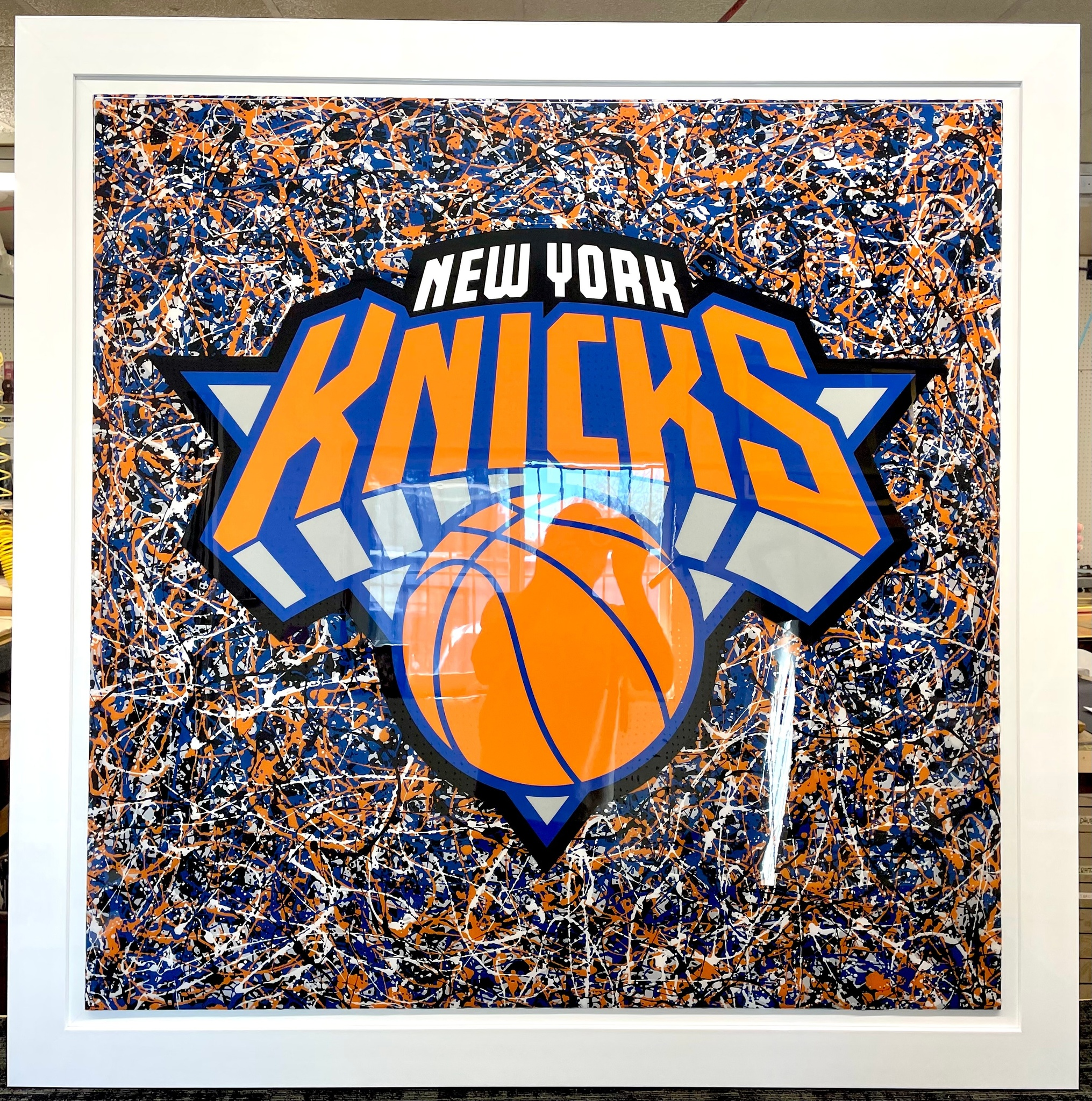 Framed sports memorabilia and jersey shadow box